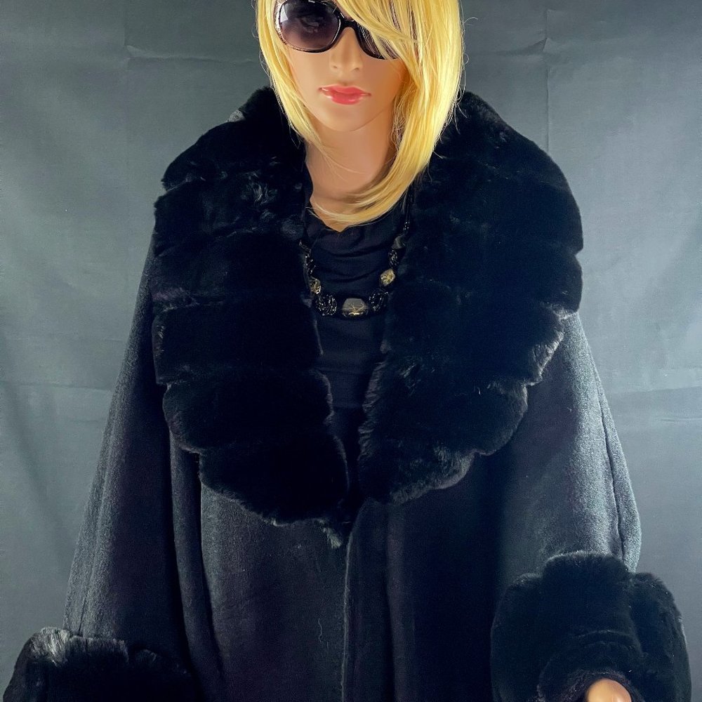 A Knit Poncho featuring Faux Fur